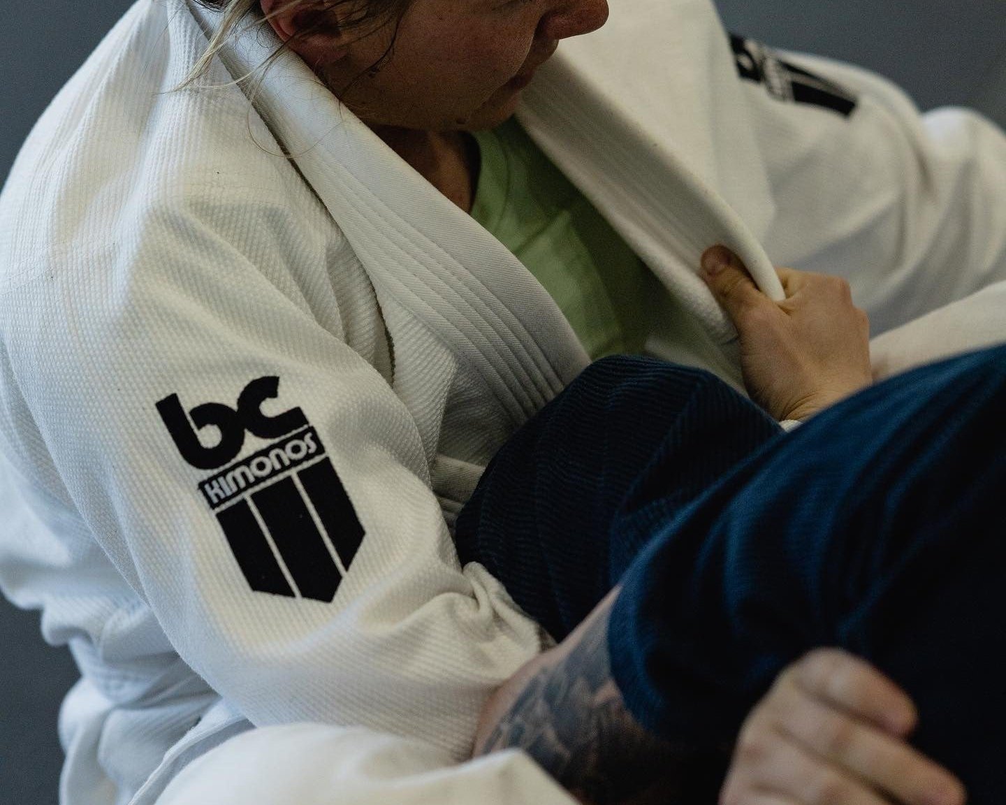 BcKimonos Whit BJJ gi Close uo on the mat