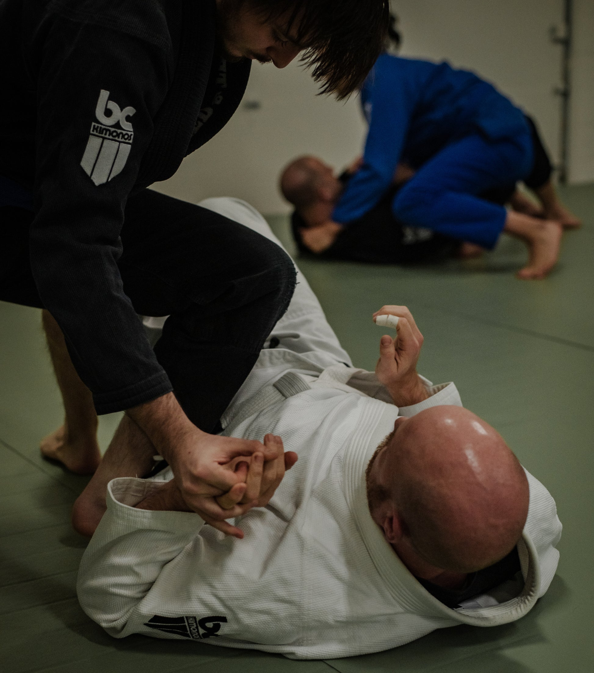 Black, White and Blue BJJ Gis in action in the gym